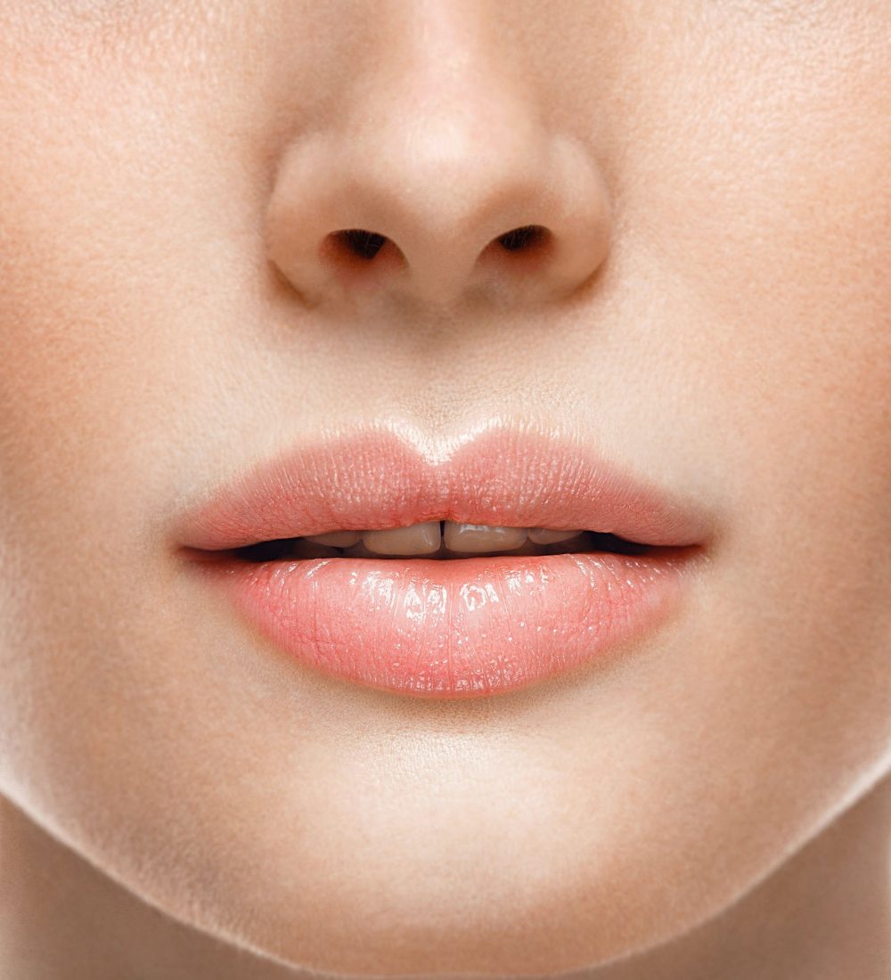 Woman face lips and nose studio white background