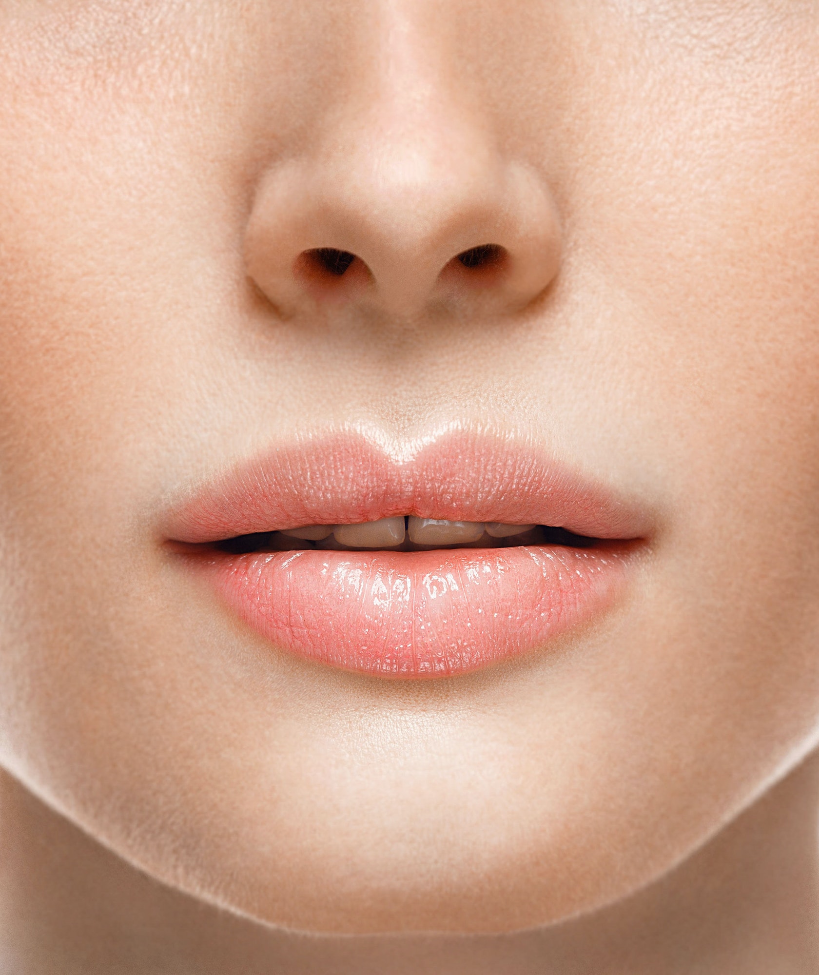 Woman face lips and nose studio white background